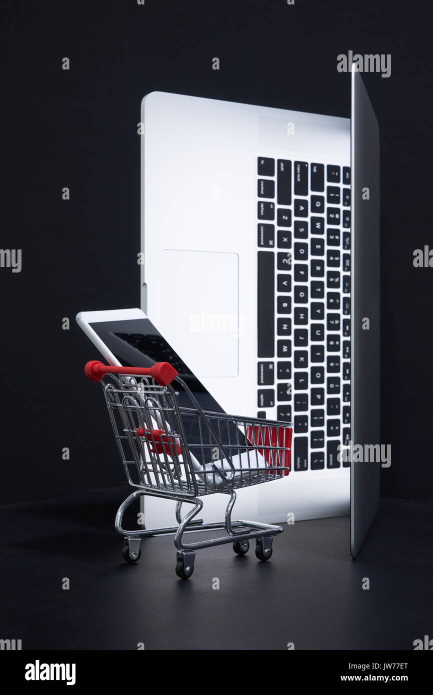 Laptop Open Like Door With A Shopping Cart Carrying