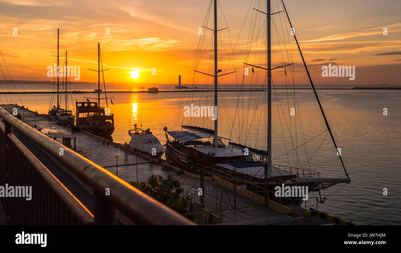 Yachts at dawn in the seaport Stock Photo - Alamy