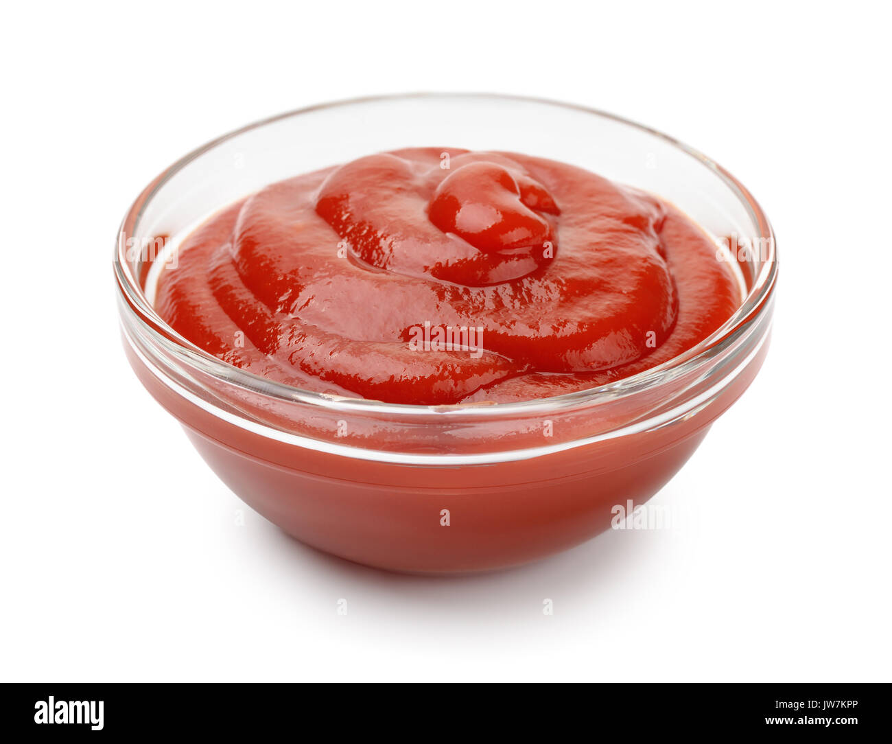 Glass bowl of ketchup isolated on white Stock Photo