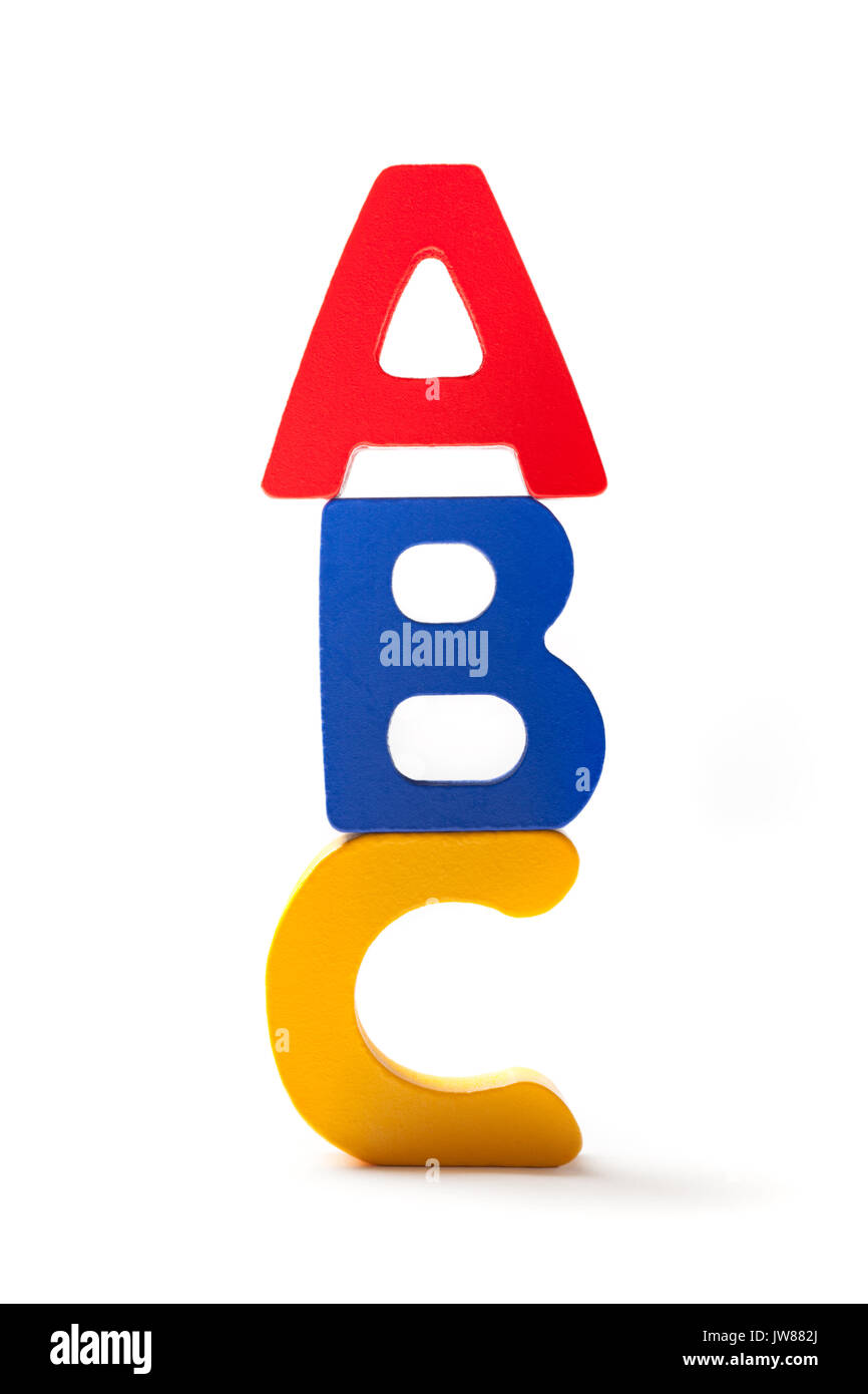 Wooden colorful alphabet letters A, B and C arranged one over the other on white background. Stock Photo