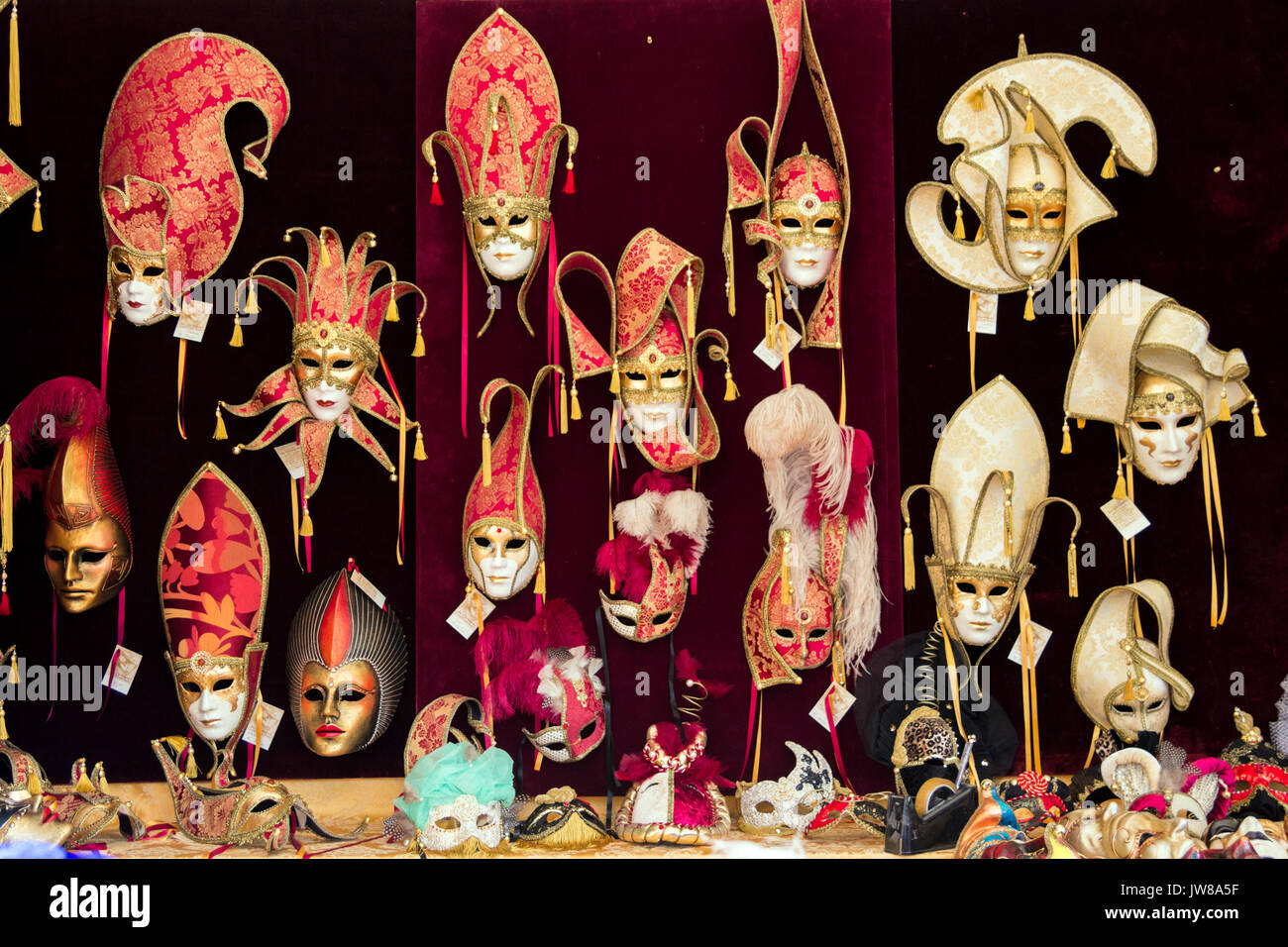 VENICE, ITALY - FEB 7, 2013: Shop window with carnival masks in a small street during the Carnival days in Venice. Stock Photo