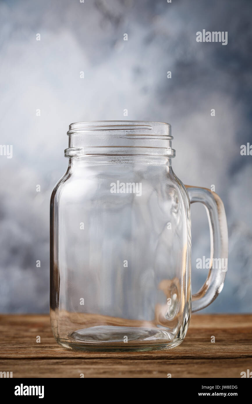 Download Empty Glass Jar On A Wooden Table Close Up Stock Photo Alamy