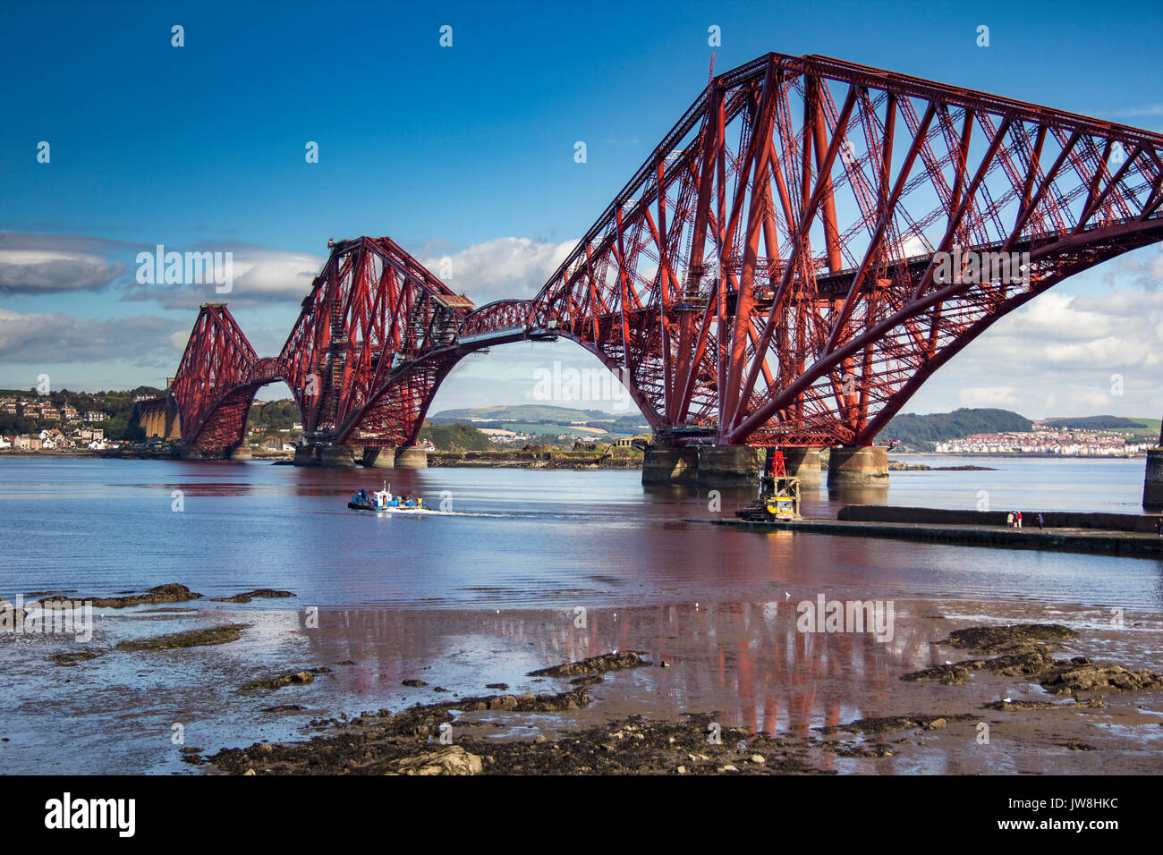 Forth Rail Bridge with ferry below, South Queensferry, Edinburgh, Scotland. Stock Photo