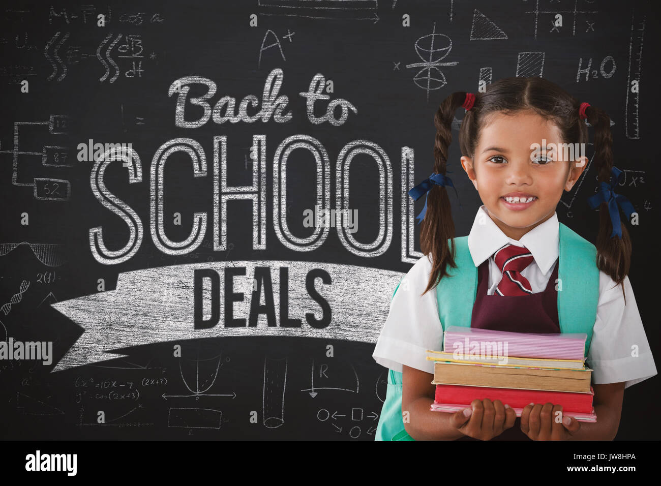 Smiling schoolgirl carrying books against black background Stock Photo ...