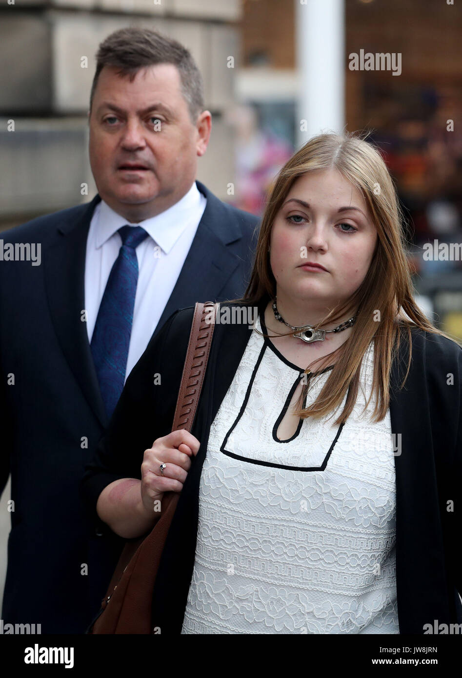 Rebecca Williams, girlfriend of Cameron Logan, arrives with her father Phillip Williams (left) at the High Court in Edinburgh, where Blair Logan was jailed for at least 20 years for the murder of his brother and attempted murder of his brother's girlfriend by setting fire to them as they slept on New Year's Day. Stock Photo