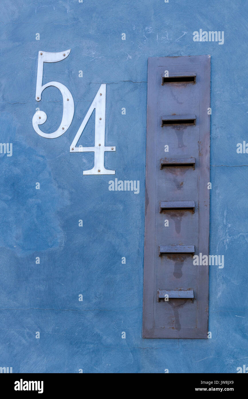 Mail box slots in apartment building number 54 Stock Photo Alamy