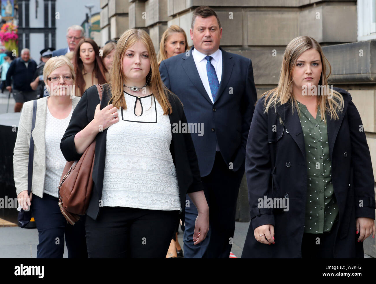 Rebecca Williams (second left) leaves the High Court in Edinburgh with her mother Lisa Williams (left), father Phillip Williams and sister Jess Williams (right), after Blair Logan was jailed for at least 20 years for the murder of his brother and attempted murder of his brother's girlfriend Rebecca by setting fire to them as they slept on New Year's Day. Stock Photo