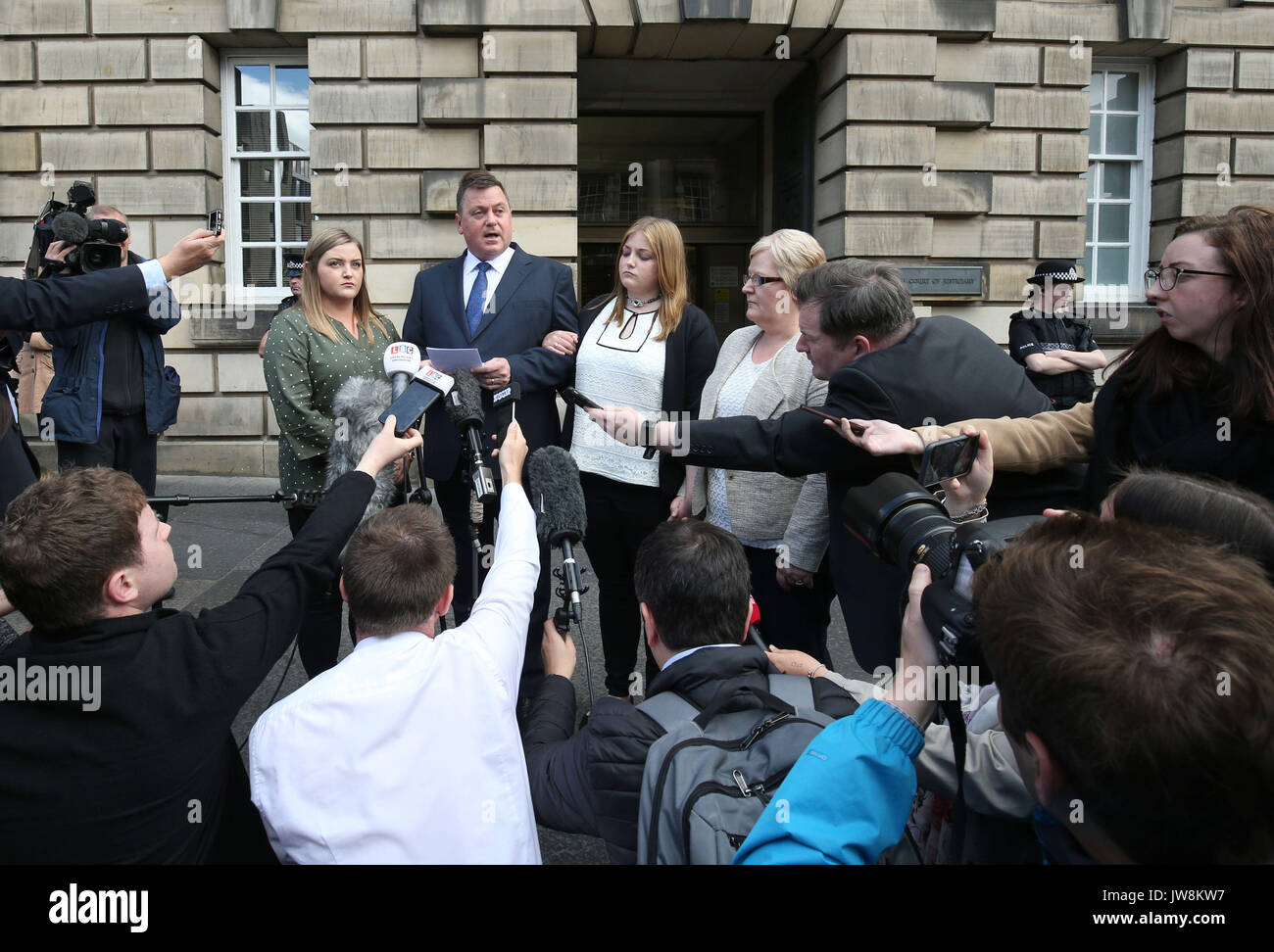 Rebecca Williams (second right) outside the High Court in Edinburgh with her sister Jess Williams (left), father Phillip Williams (second left) and mother Lisa Williams (right), after Blair Logan was jailed for at least 20 years for the murder of his brother and attempted murder of his brother's girlfriend Rebecca by setting fire to them as they slept on New Year's Day. Stock Photo