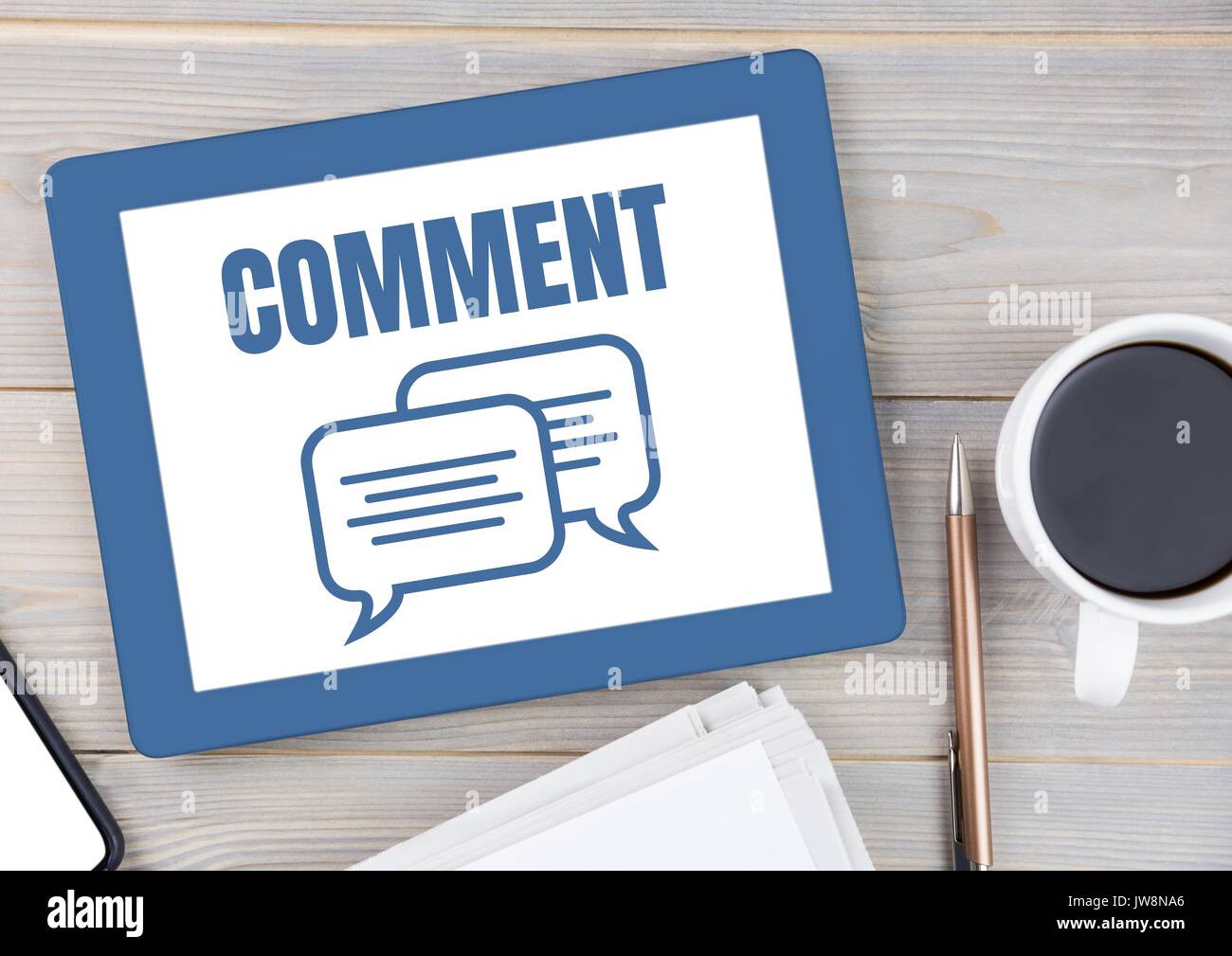 Digital composite of Comment text and chat graphic on tablet screen Stock Photo