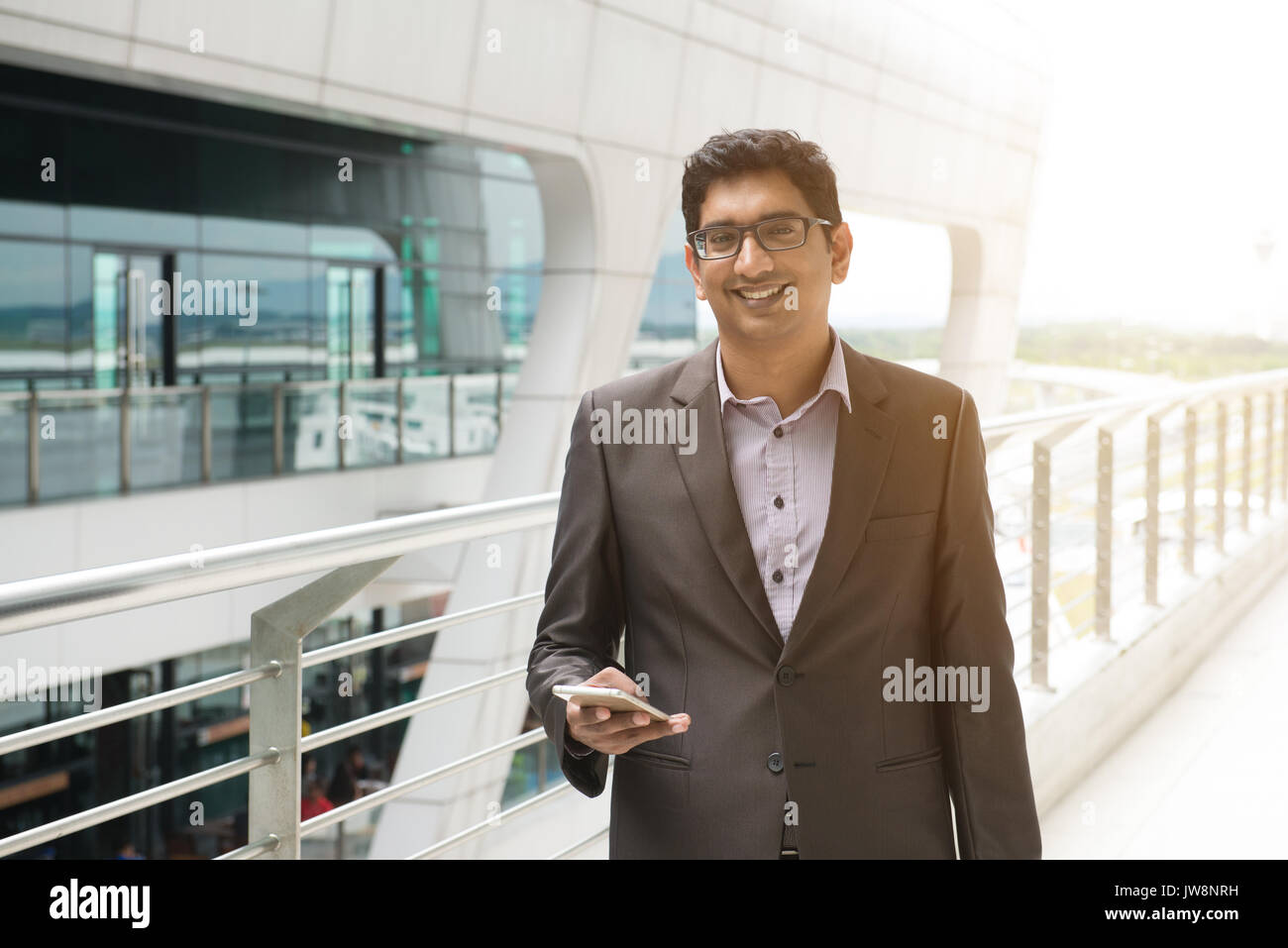 Indian man phone airport hi-res stock photography and images - Alamy