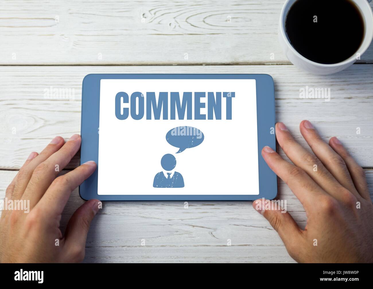 Digital composite of Comment text and chat graphic on tablet screen with hands Stock Photo