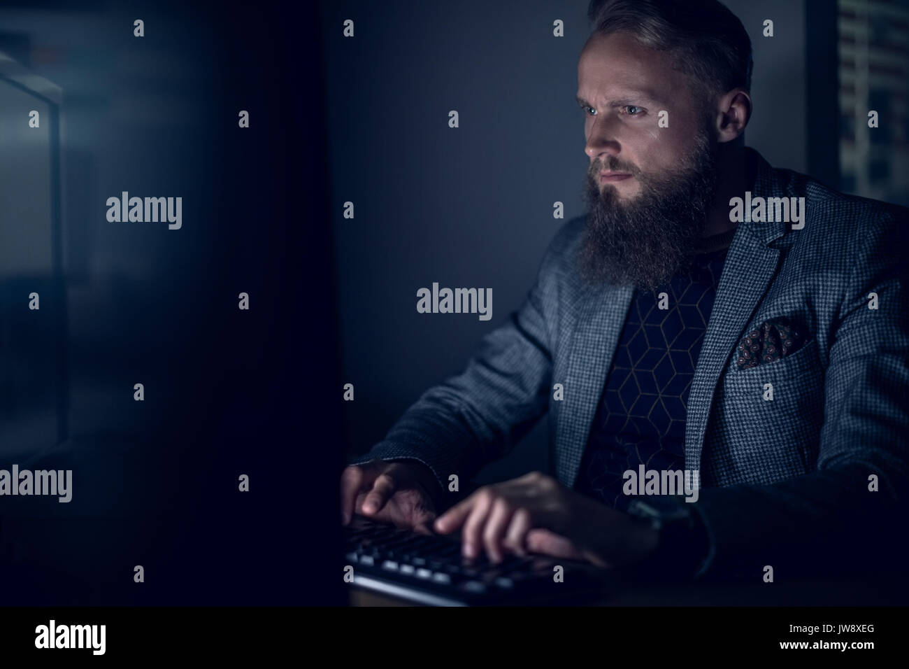 Businessman working at desk in office Stock Photo