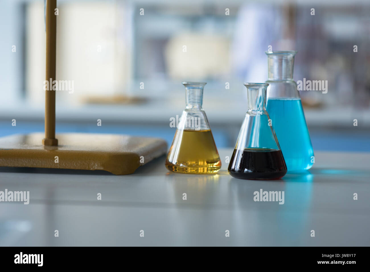 Close up of chemicals in beaker on table Stock Photo