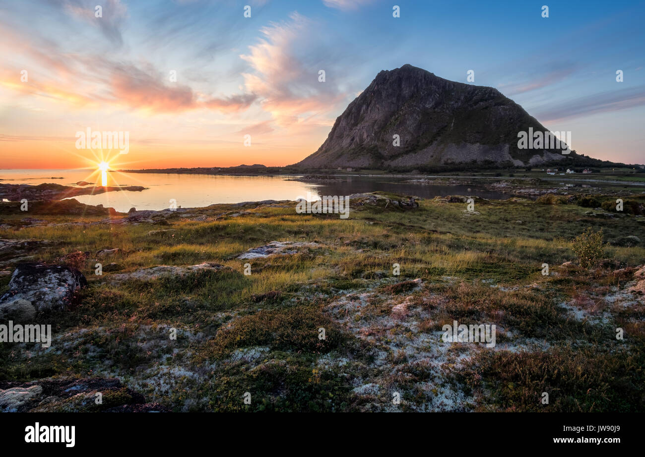Scenic view with sunset and mountain at summer night in Lofoten, Norway. Stock Photo