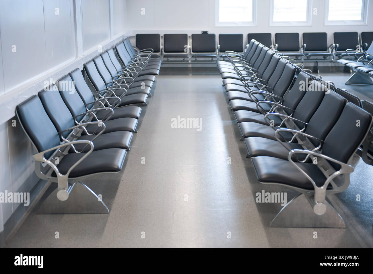 waiting room with black leather seating Stock Photo