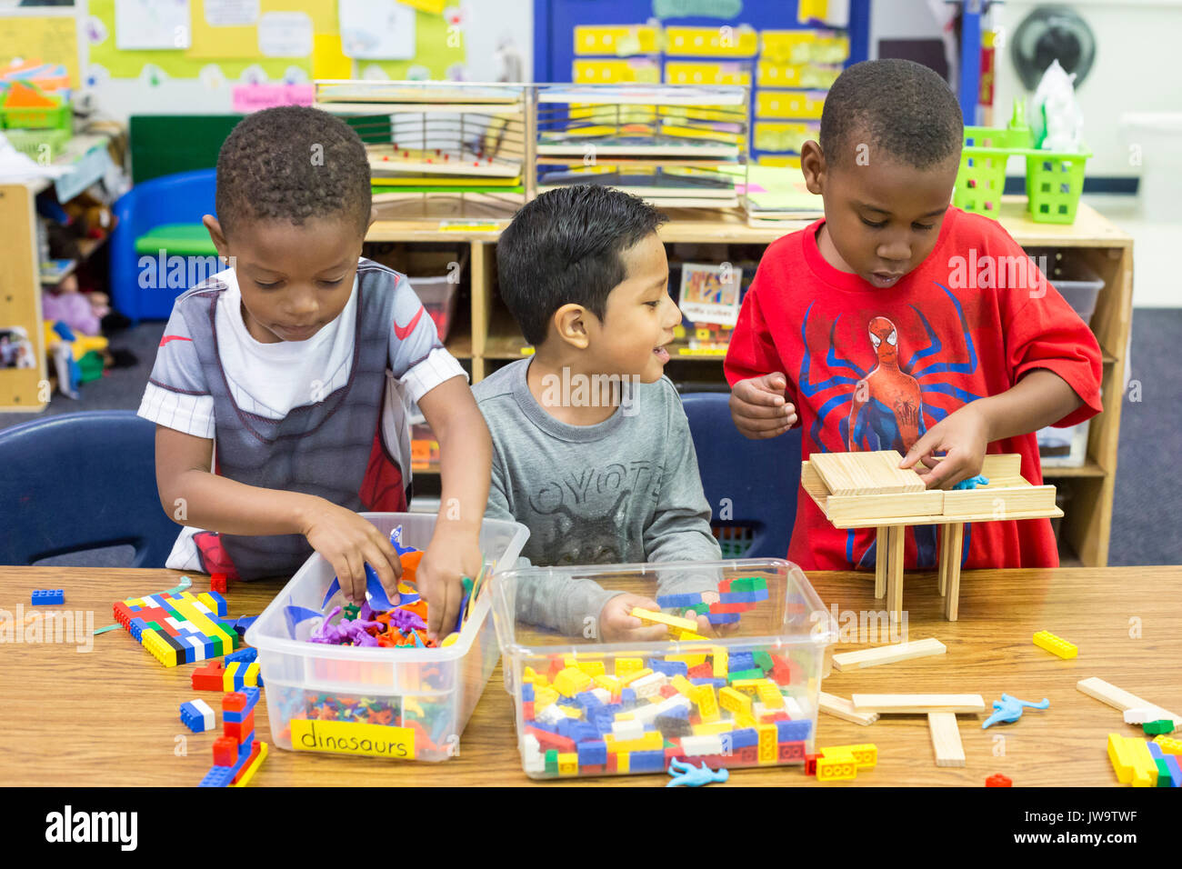 Charlotte, North Carolina - Boys play with legos and dinosaurs in Head Start at the Bethlehem Center. The Center serves low-income families in Charlot Stock Photo