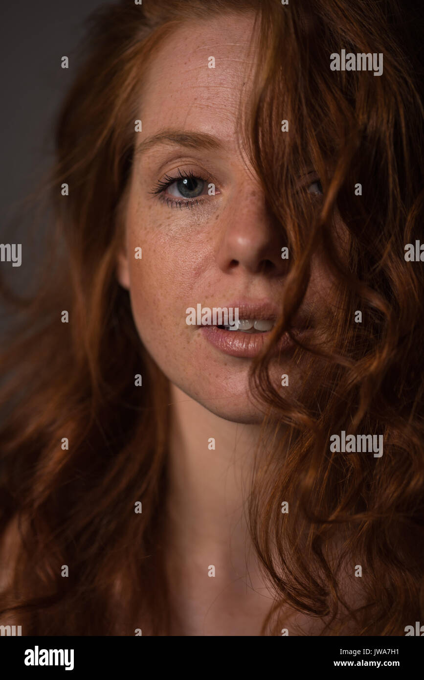 sensual portrait of a redheaded beautiful woman Stock Photo - Alamy