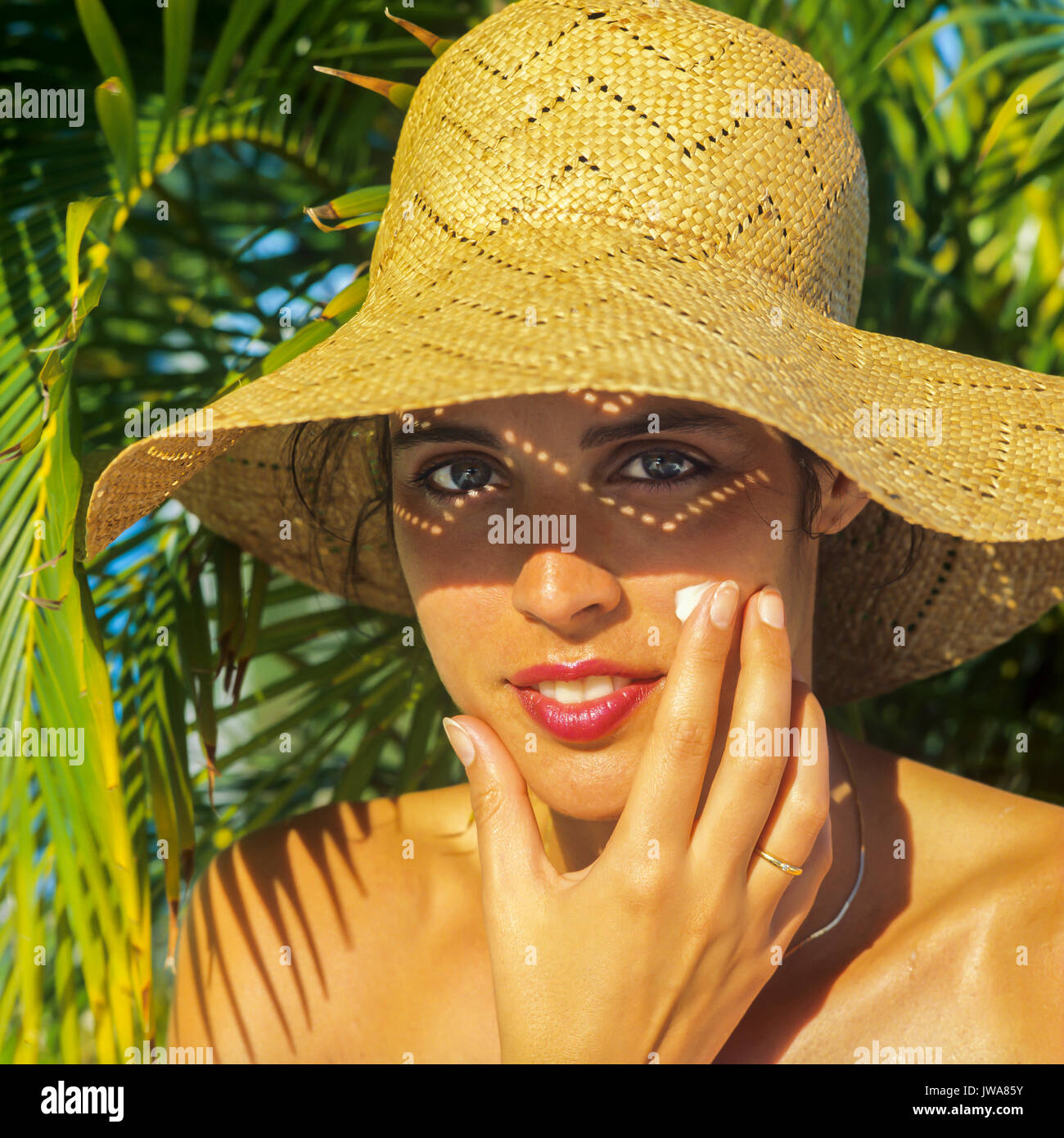 Tanned woman cream face hi-res stock photography and images - Alamy