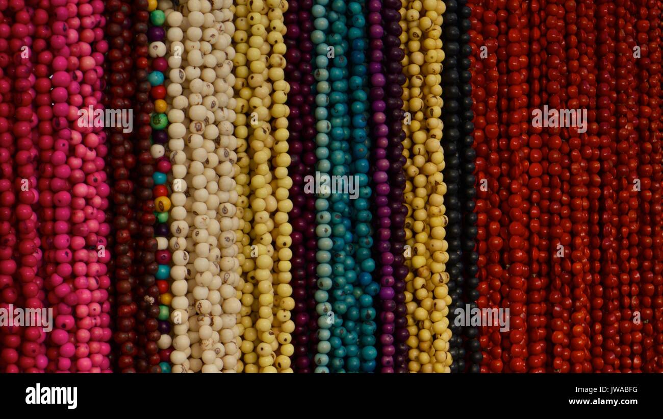 Multiple colored objects from masks to beads. Stock Photo