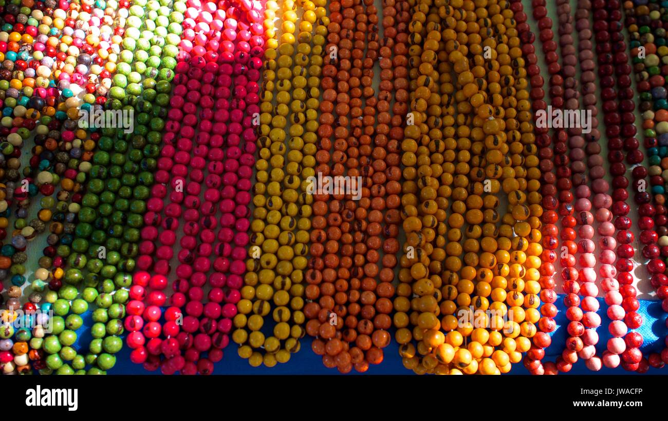 Multiple colored objects from masks to beads. Stock Photo