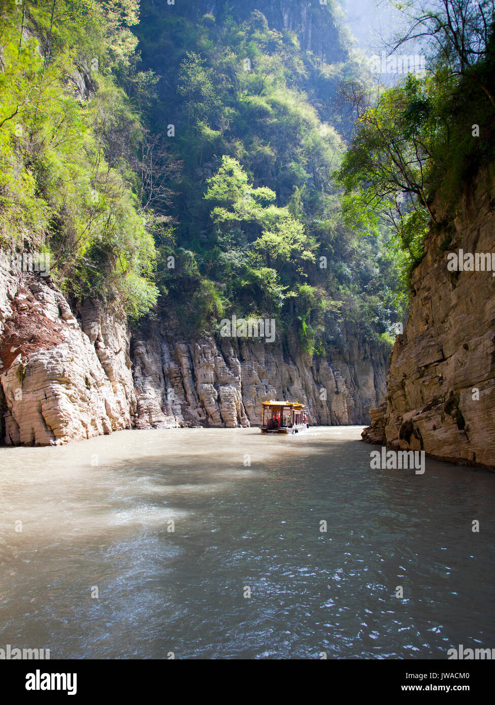 Excursion boat on Goddess Stream, tributary of the Yangtze River, China.  This was once a wild river carving through a rugged canyon, tamed now by the Stock Photo
