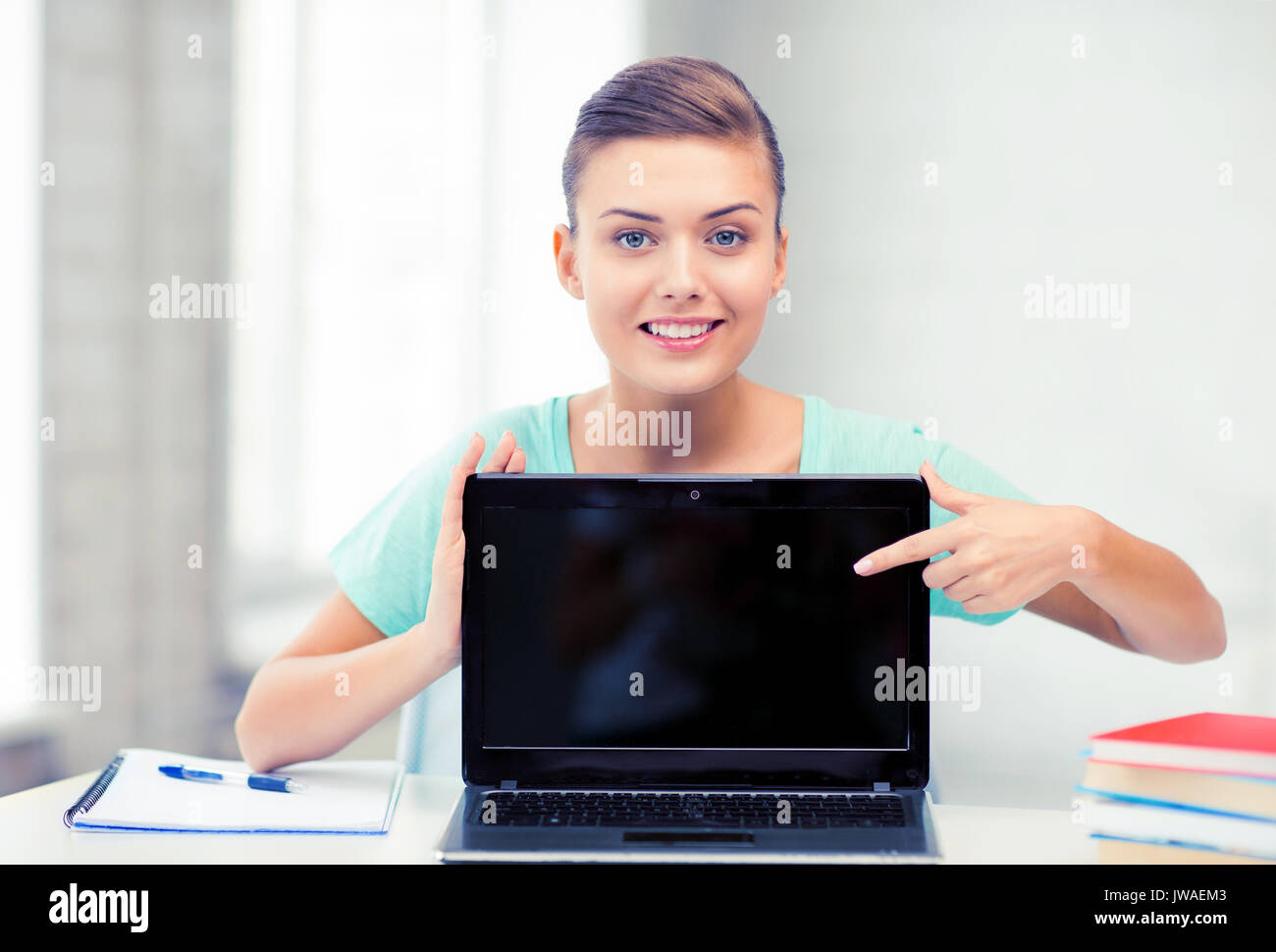 smiling student girl with laptop at school Stock Photo - Alamy