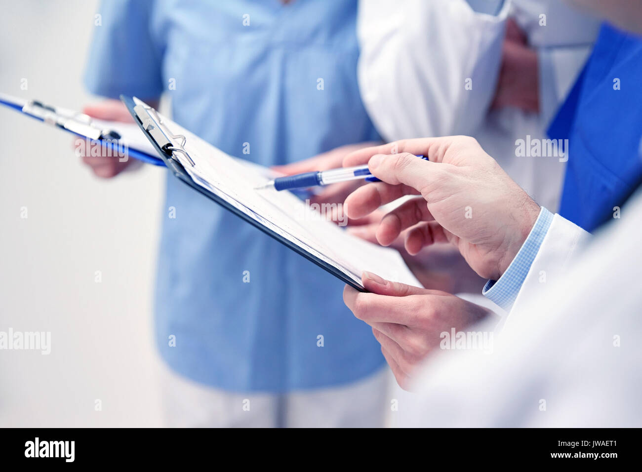 close up of doctors with clipboard at hospital Stock Photo - Alamy