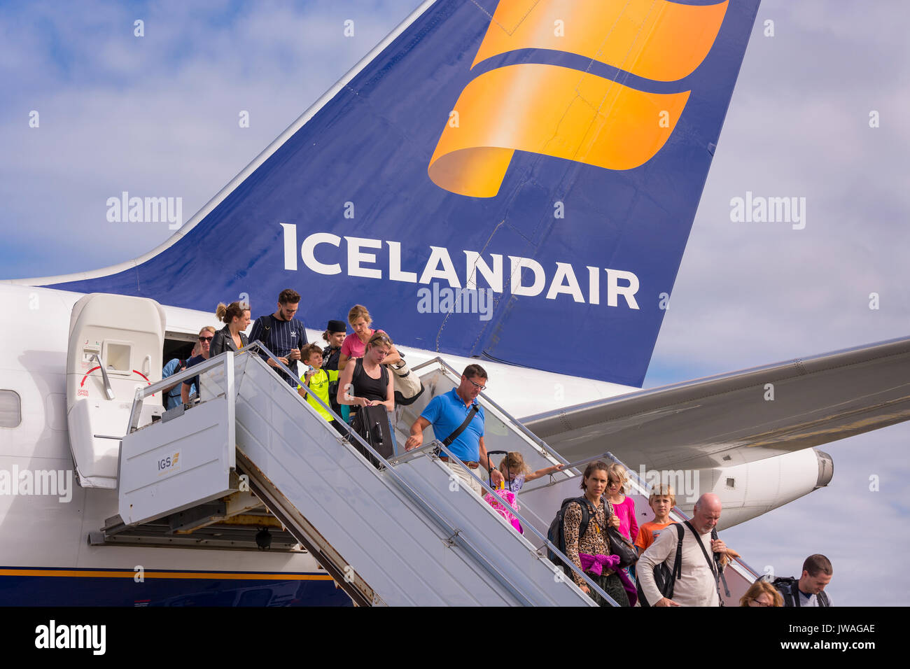 KEFLAVIK INTERNATIONAL AIRPORT, ICELAND - Arriving passengers getting off Icelandair jetliner. Stock Photo
