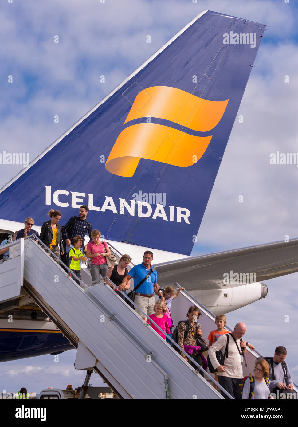 KEFLAVIK INTERNATIONAL AIRPORT, ICELAND - Arriving passengers getting off Icelandair jetliner. Stock Photo