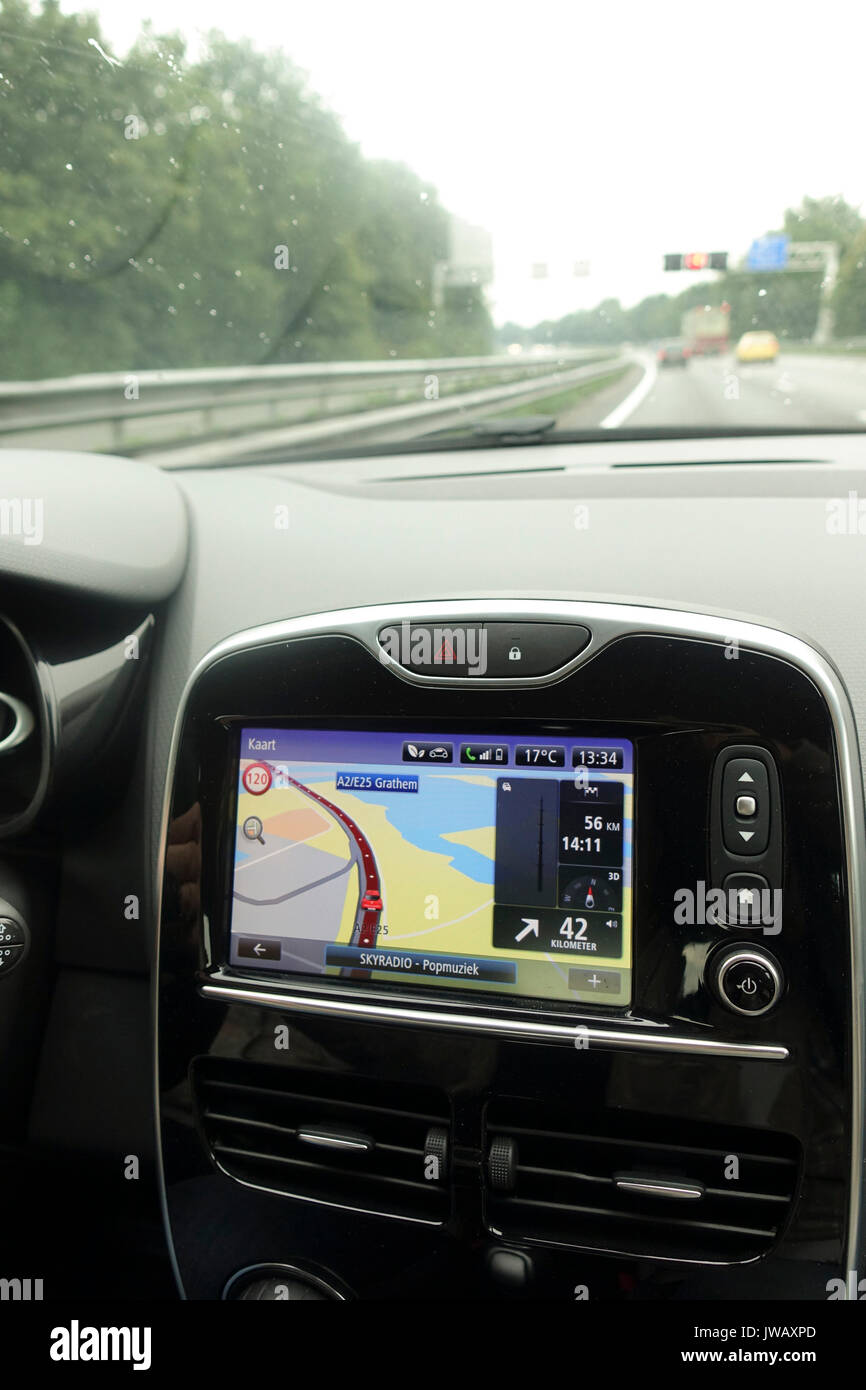 Car navigation system build in interior of modern european car with GPS system on. Netherlands. Stock Photo