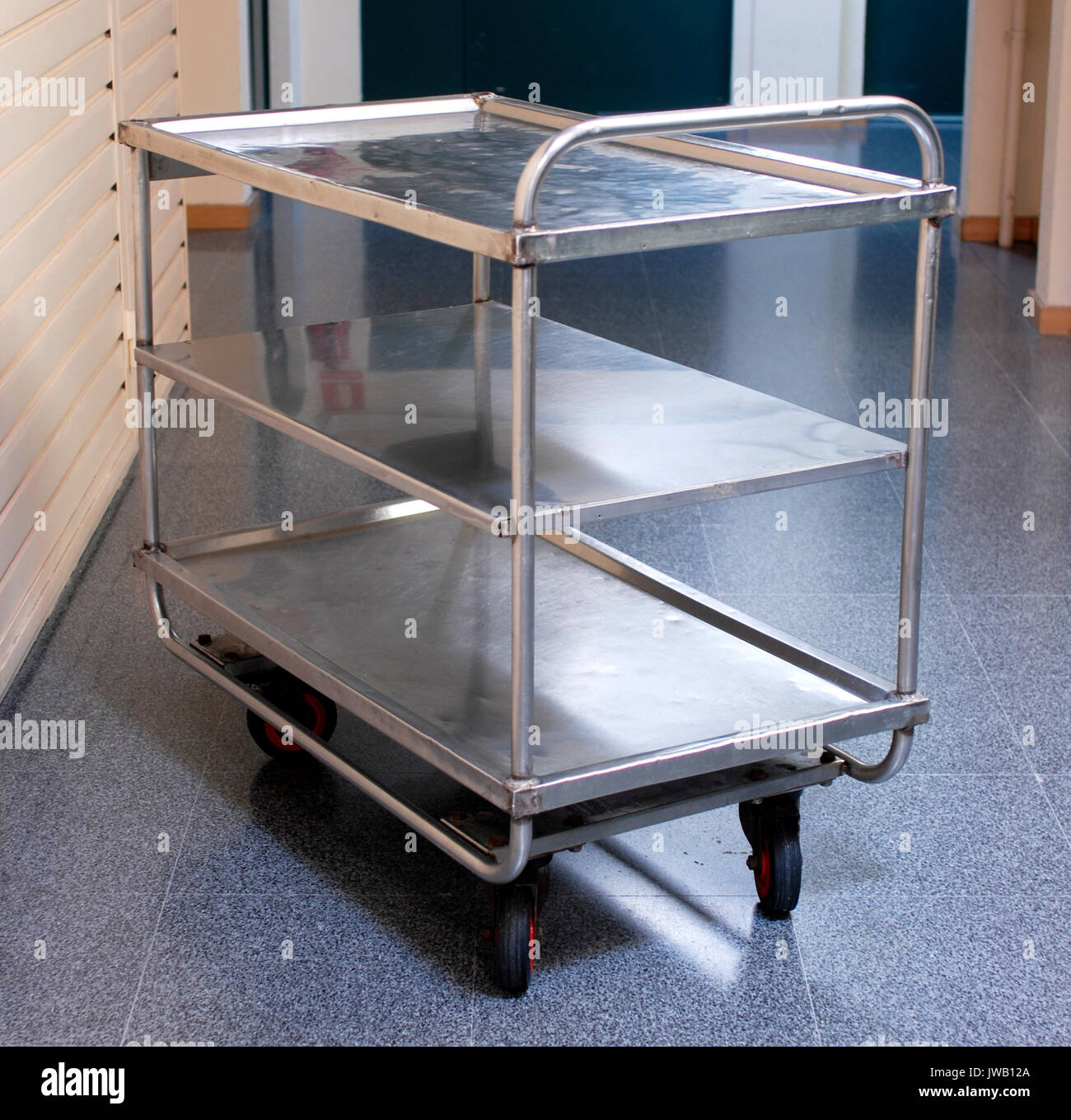 Tray, trolley with wheels for kitchens, stainless steel Stock Photo - Alamy