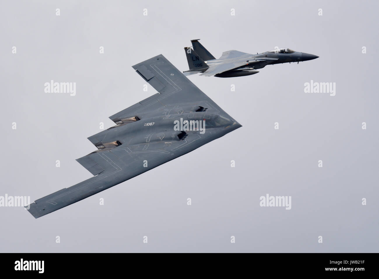 Northrop Grumman B-2 Spirit stealth bomber of the US Air Force Global Strike Command. Named Spirit of Pennsylvania it was escorted by a F-15 fighter Stock Photo