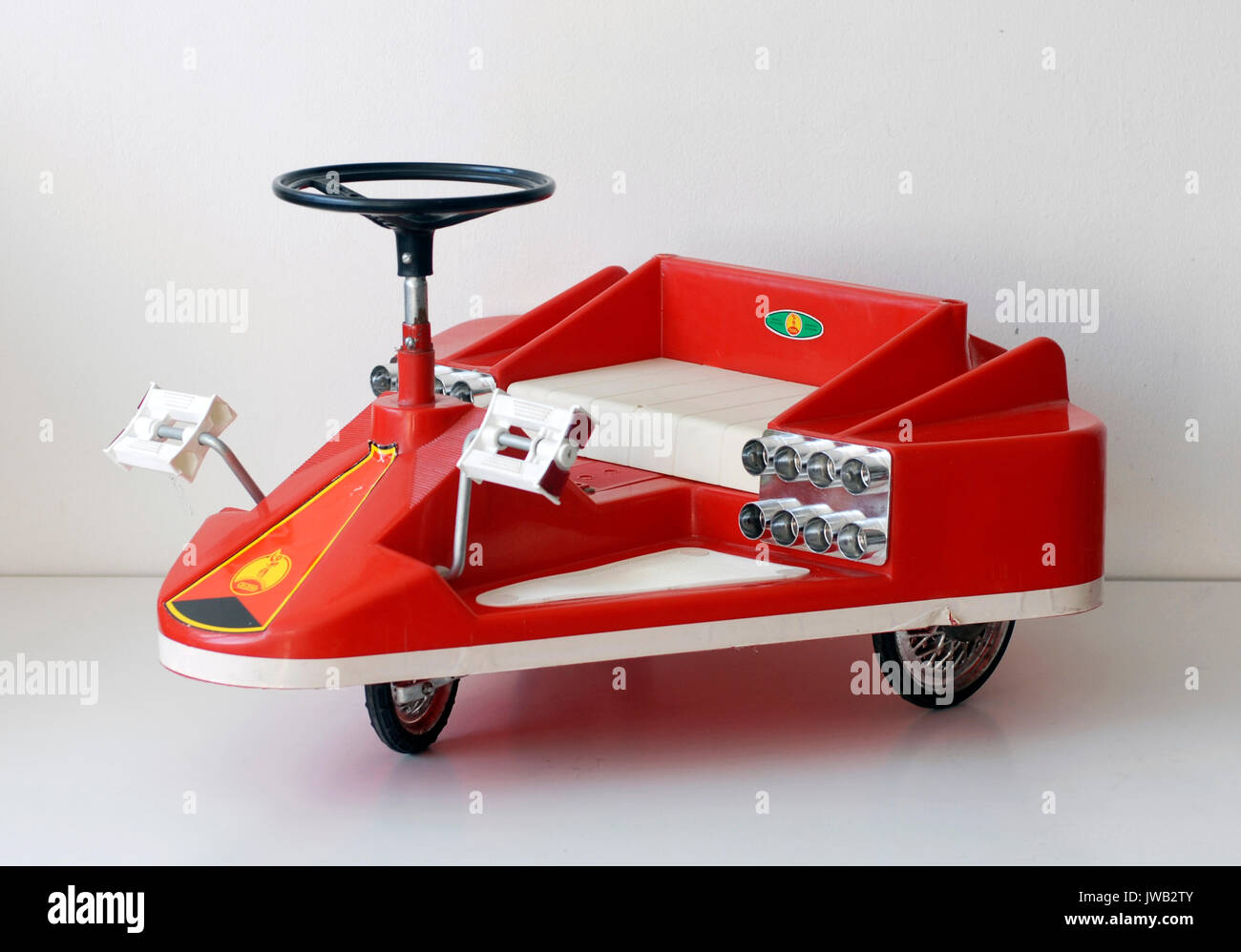 Vintage toy tricycle with spacecraft shape. Coloma, manufactured in