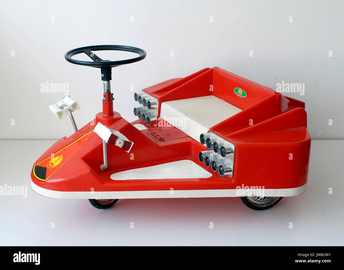 Vintage toy tricycle with spacecraft shape. Coloma, manufactured in