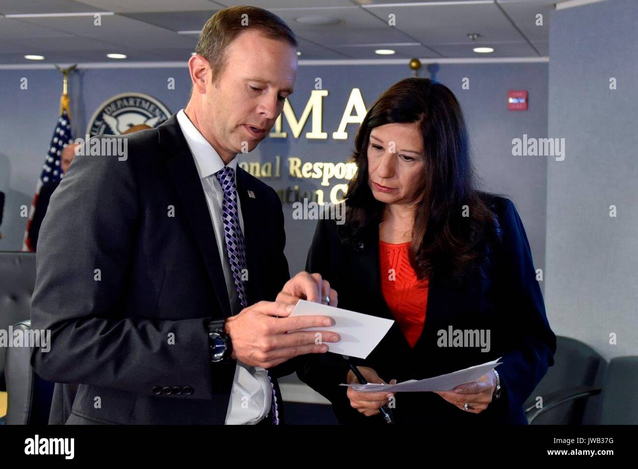 FEMA Administrator Brock Long, left, chats with Acting Homeland Security Secretary Elaine Duke before briefing U.S. President Donald Trump on the hurricane season at the Federal Emergency Management Agency headquarters August 4, 2017 in Washington, D.C. Stock Photo