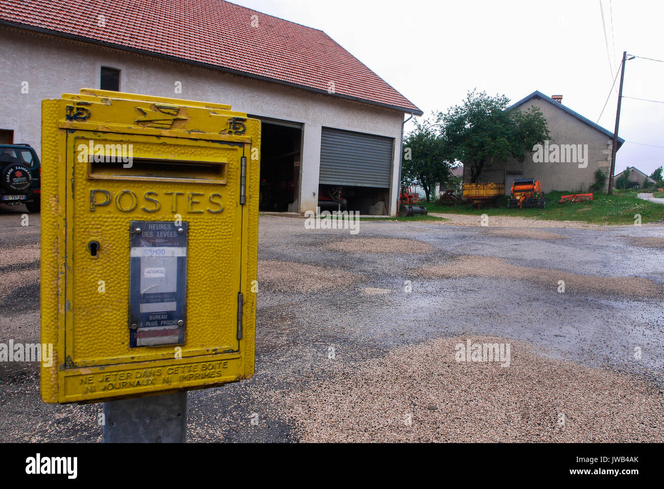 Yellow mailbox in a french village of Jura (France Stock Photo Alamy