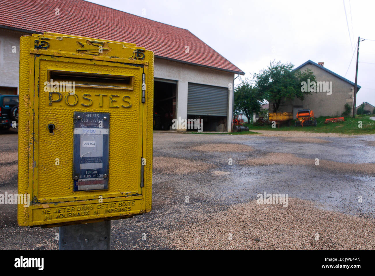 Yellow mailbox in a french village of Jura (France Stock Photo Alamy