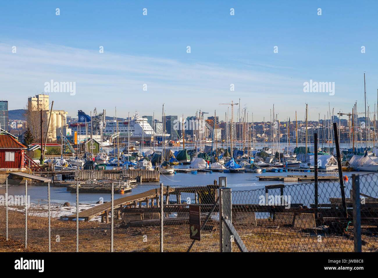 OSLO, NORWAY - 27 FEB 2016: City waterfront with modern buildings, yachts, ferry. View from Hovedoya island. Stock Photo