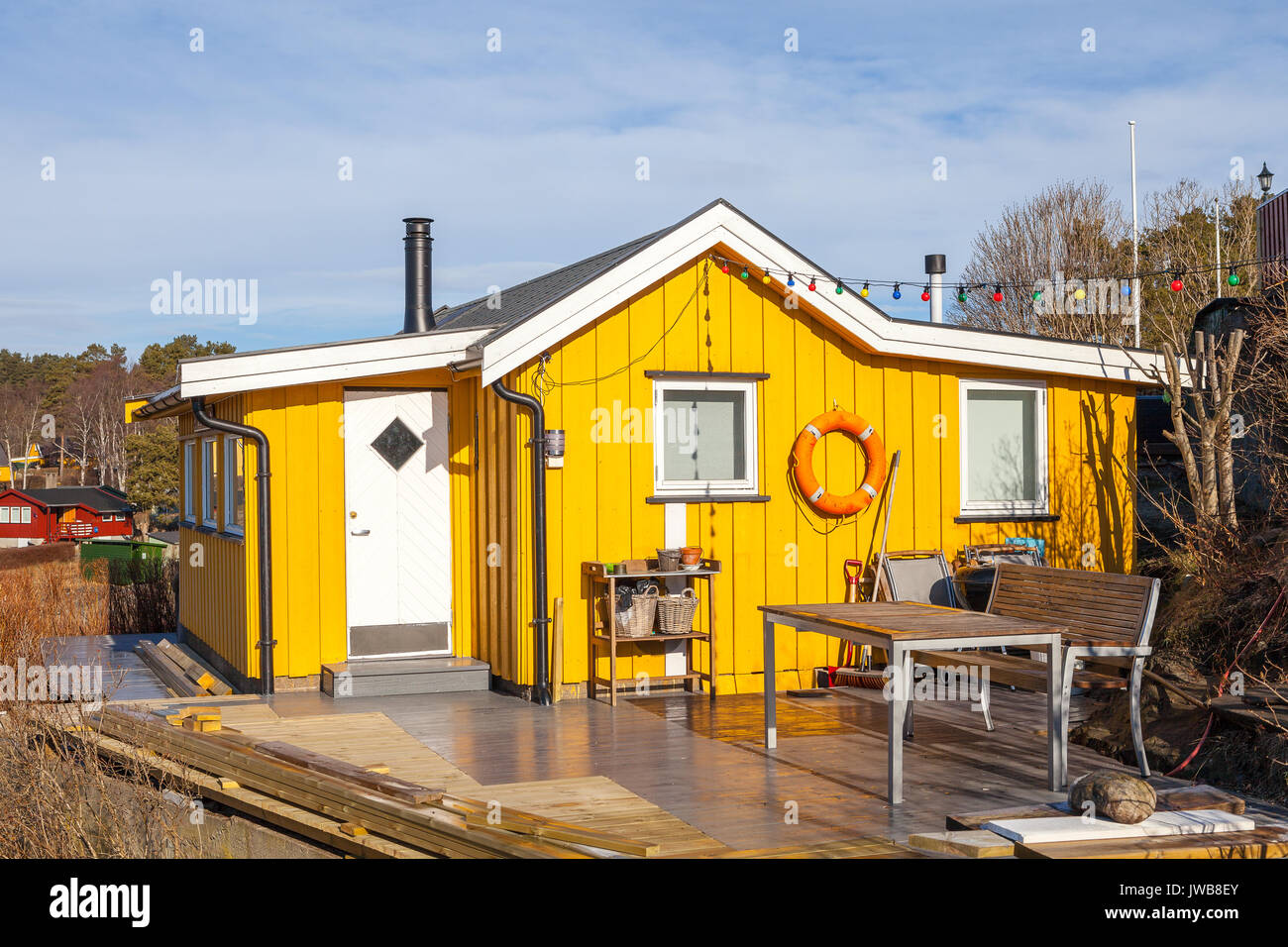 Yellow wooden cabin on the island, Norwegian style Stock Photo Alamy