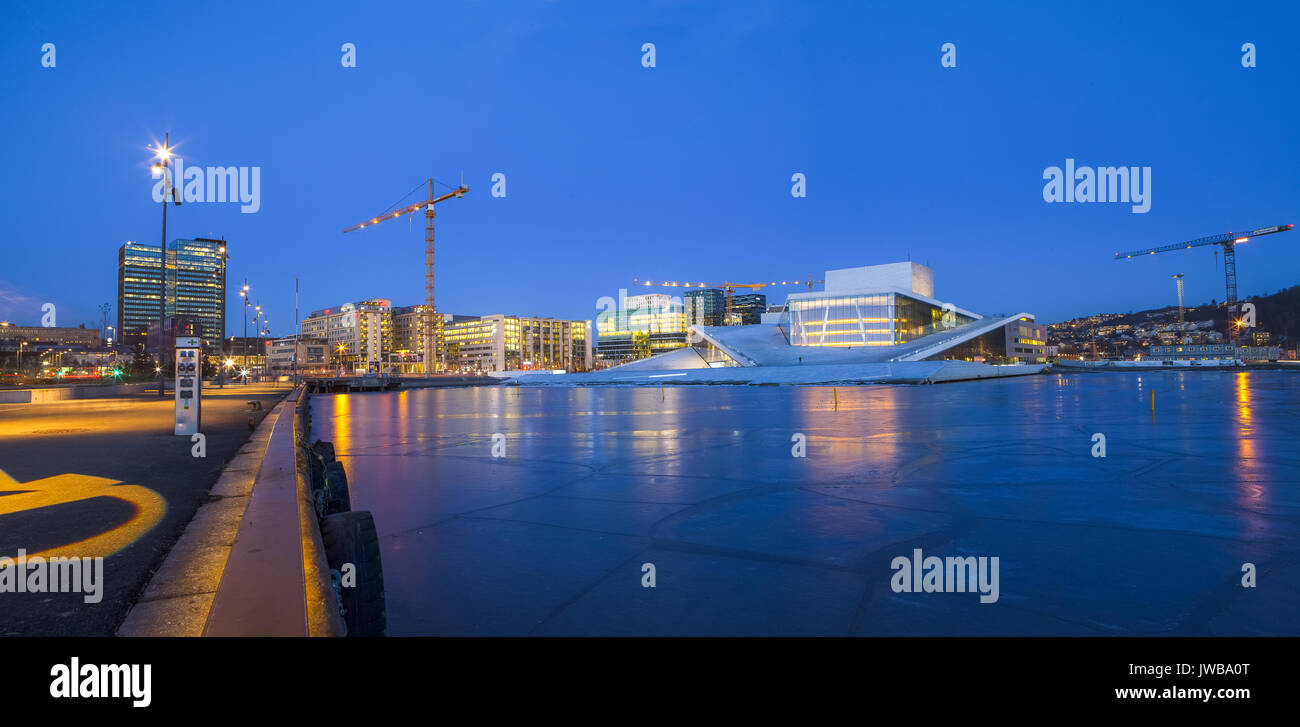 Night panoramic view of the Oslo Opera House, frozen bay and new business quarter Stock Photo