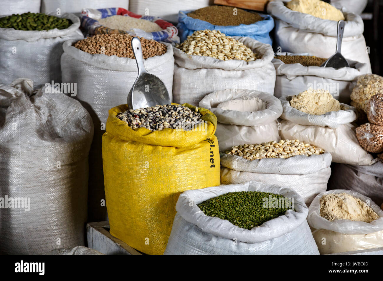 Grains (whole and milled) display, San Pedro Market, Cusco, Peru Stock Photo