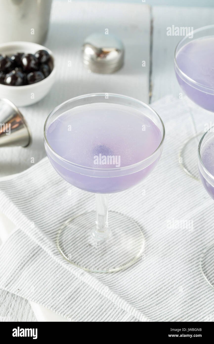 Sweet Violet Aviation Cocktail with a Cherry Garnish Stock Photo