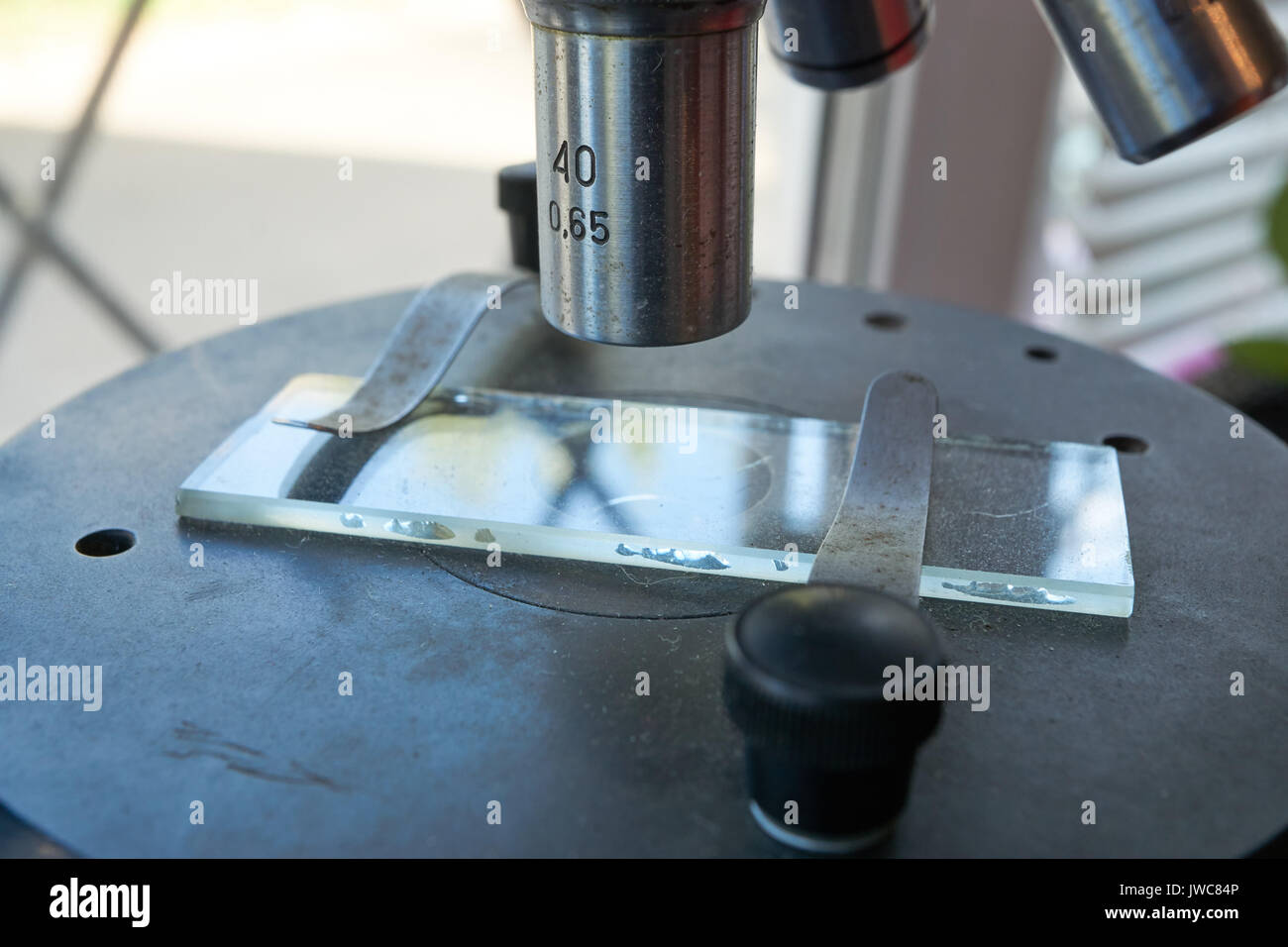 closeup shot of retro vintage medical biological dusty microscope