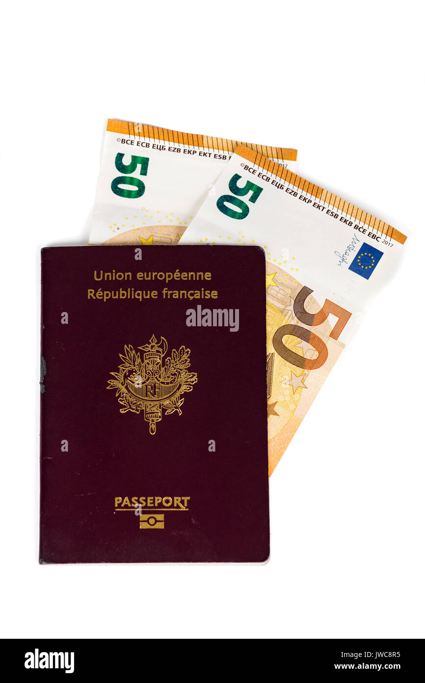100 euro bills banknotes inserted between pages of european French  passport. Concept price travel, backchich. Front and top view, close-up  Stock Photo - Alamy