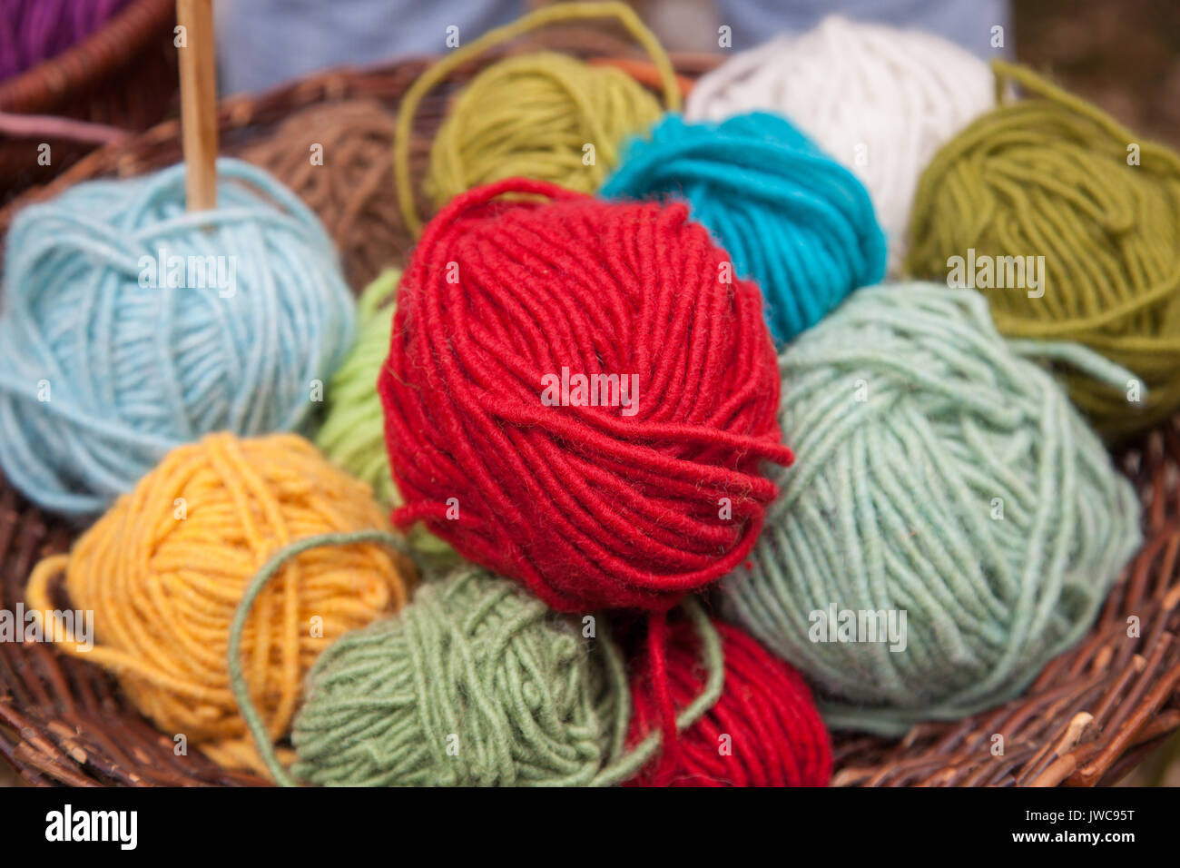 Colorful wool balls in basket Stock Photo Alamy
