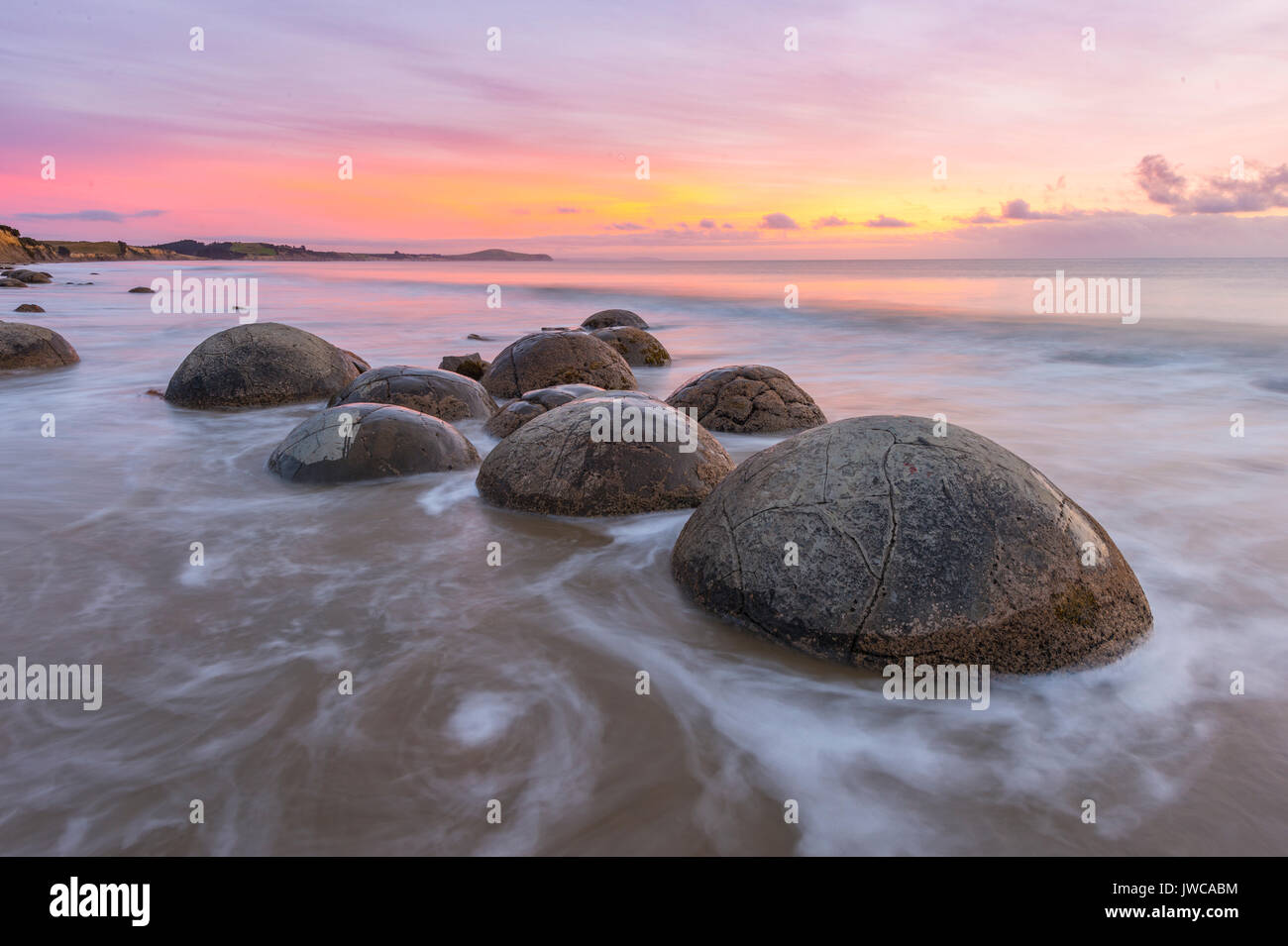 Moeraki boulders, at sunrise, geological formation, Koekohe Beach, Moeraki, East Coast, Otago, South Island, New Zealand Stock Photo