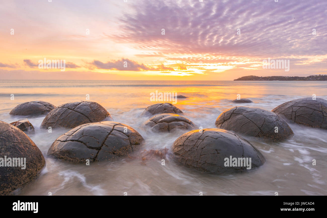 Moeraki boulders, at sunrise, geological formation, Koekohe Beach, Moeraki, East Coast, Otago, South Island, New Zealand Stock Photo