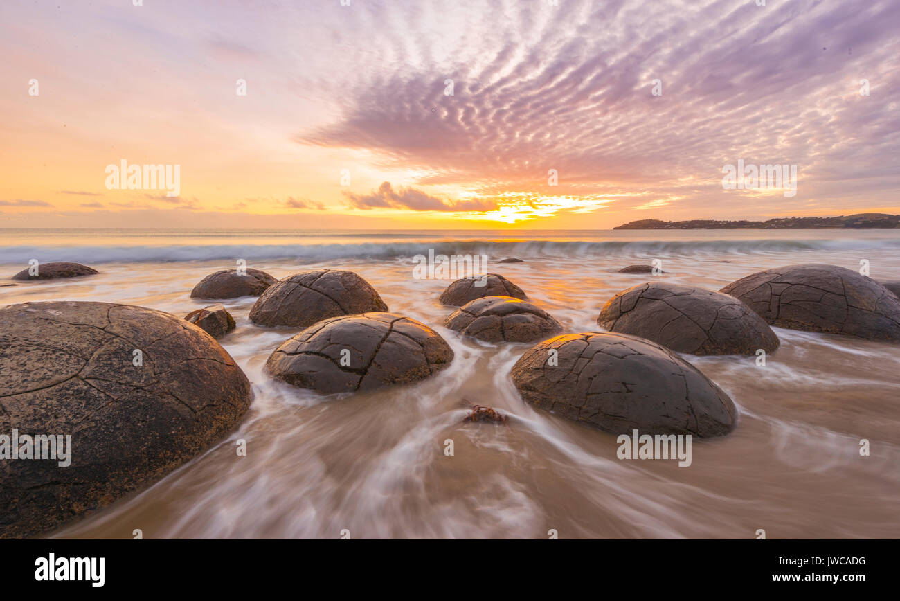Moeraki boulders, at sunrise, geological formation, Koekohe Beach, Moeraki, East Coast, Otago, South Island, New Zealand Stock Photo