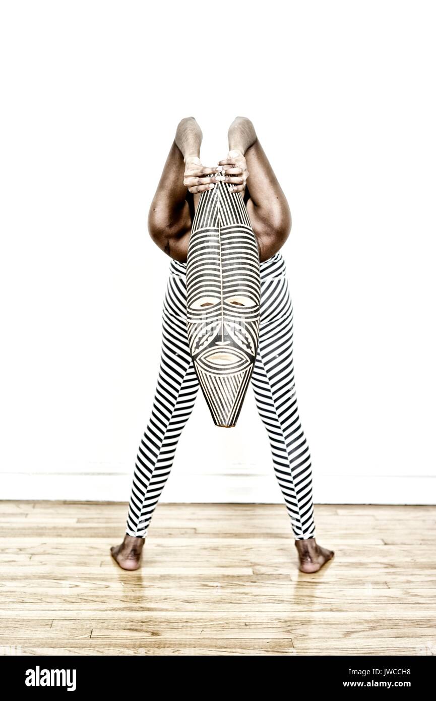 A dancer wearing costume and mask Stock Photo Alamy