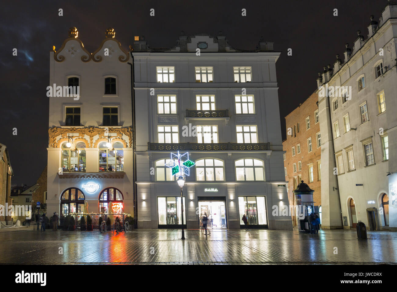 KRAKOW, POLAND - JANUARY 12, 2017: People walk along Hard Rock Cafe and Zara  store on Main Market square in old town at night. Krakow is the second la  Stock Photo - Alamy